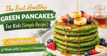 Stack of healthy green pancakes made with fresh spinach and banana, topped with maple syrup and fruit for a kid-friendly breakfast.