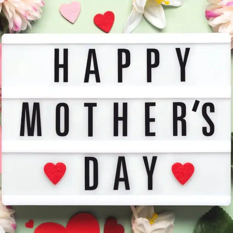 Happy Mother’s Day sign with hearts celebrating and encouraging moms.