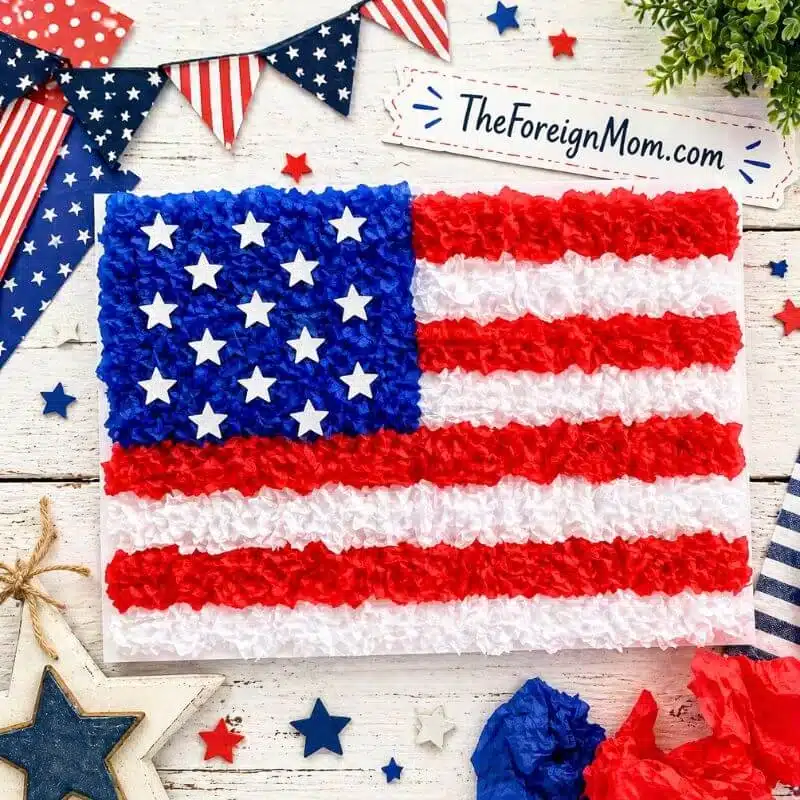Kids American flag craft made with red white and blue tissue paper and stars – easy patriotic Memorial Day craft for kids.