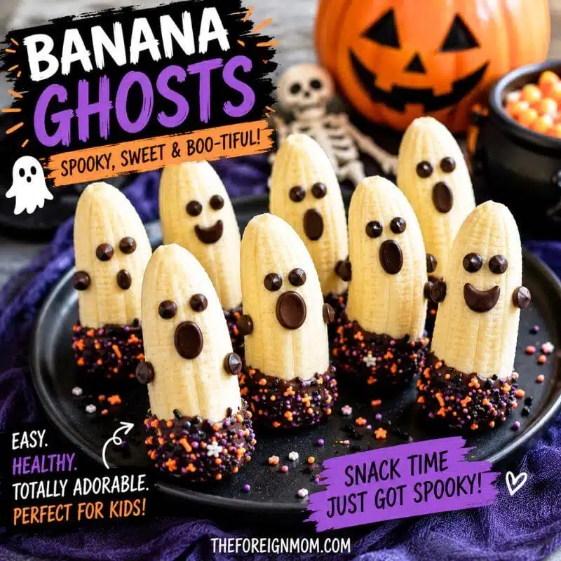 Banana ghosts with chocolate chip faces dipped in melted chocolate and Halloween sprinkles for a fun Halloween snack for kids.