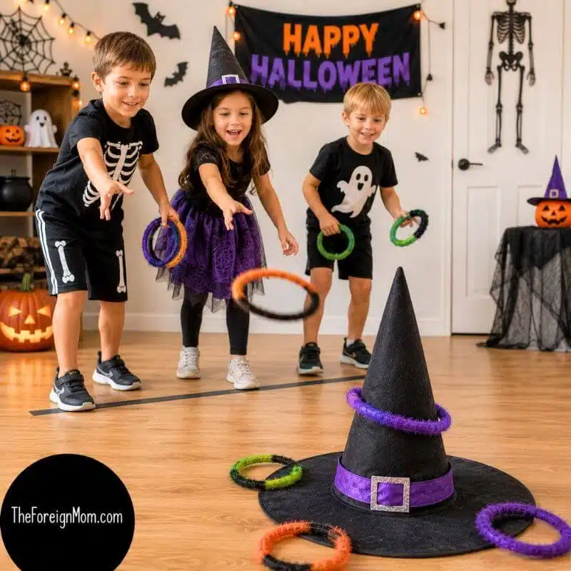 Kids playing witch hat ring toss at a Halloween party by tossing colorful rings onto a witch hat.