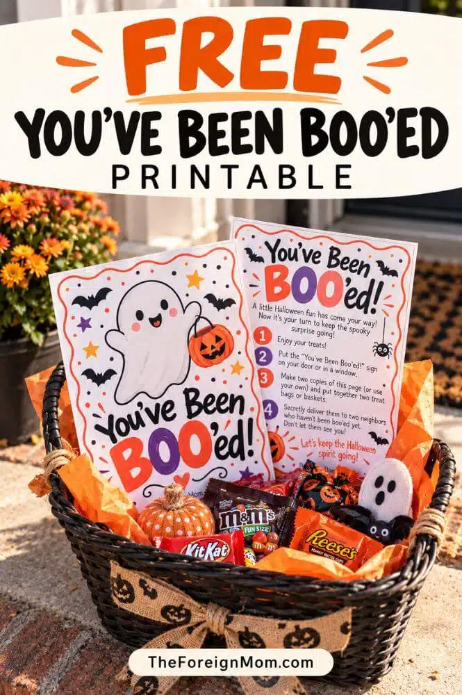 Halloween boo basket filled with candy and two You’ve Been Booed printable pages.