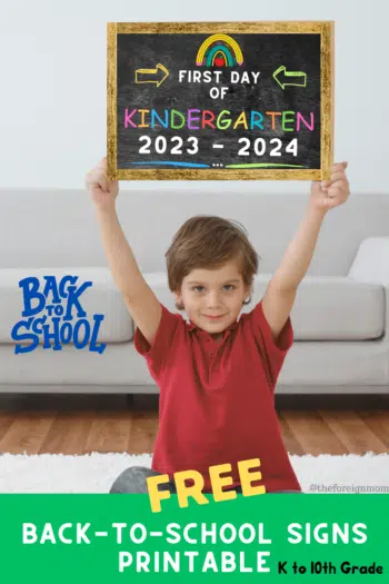 Boy holding a frame up with a back to school sign.