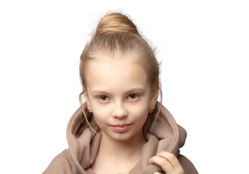 Girl with top knot hairstyle.
